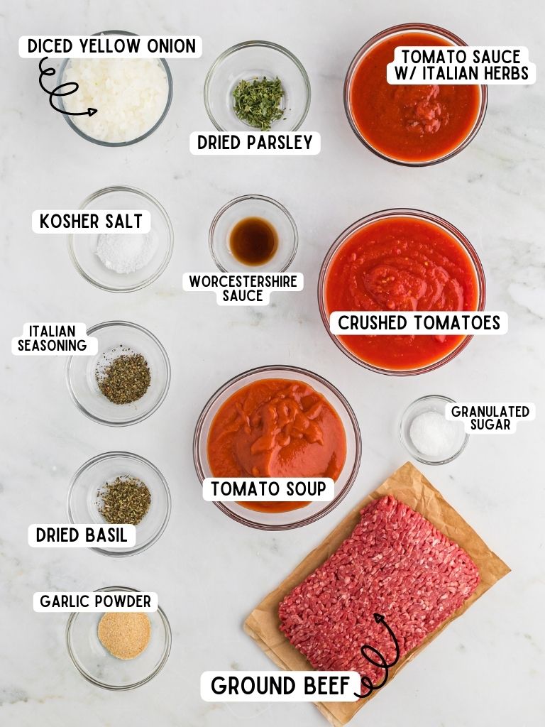 Ingredients needed to make this pasta sauce recipe with each one labeled in black text with the title of it. 