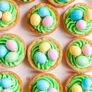 Overhead picture of easter treats with eggs on top if the sugar cookie base.