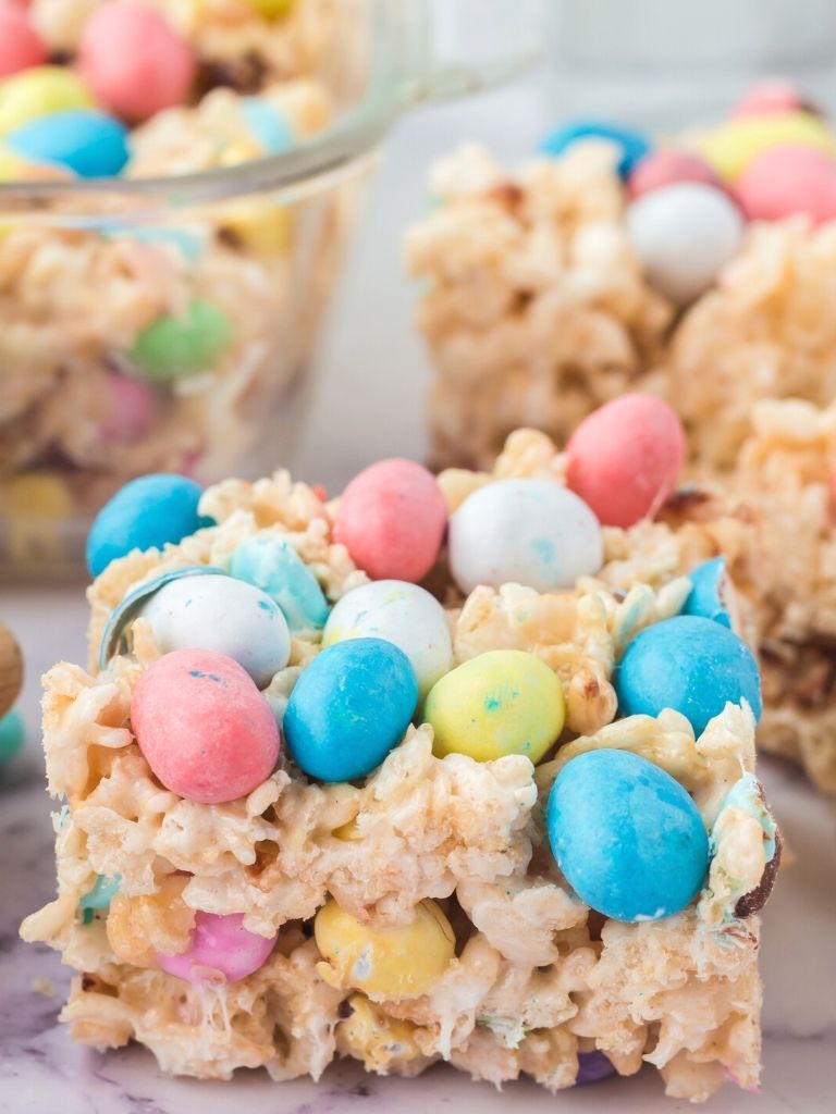 One Rice Krispies treat topped with candy robin eggs on top.