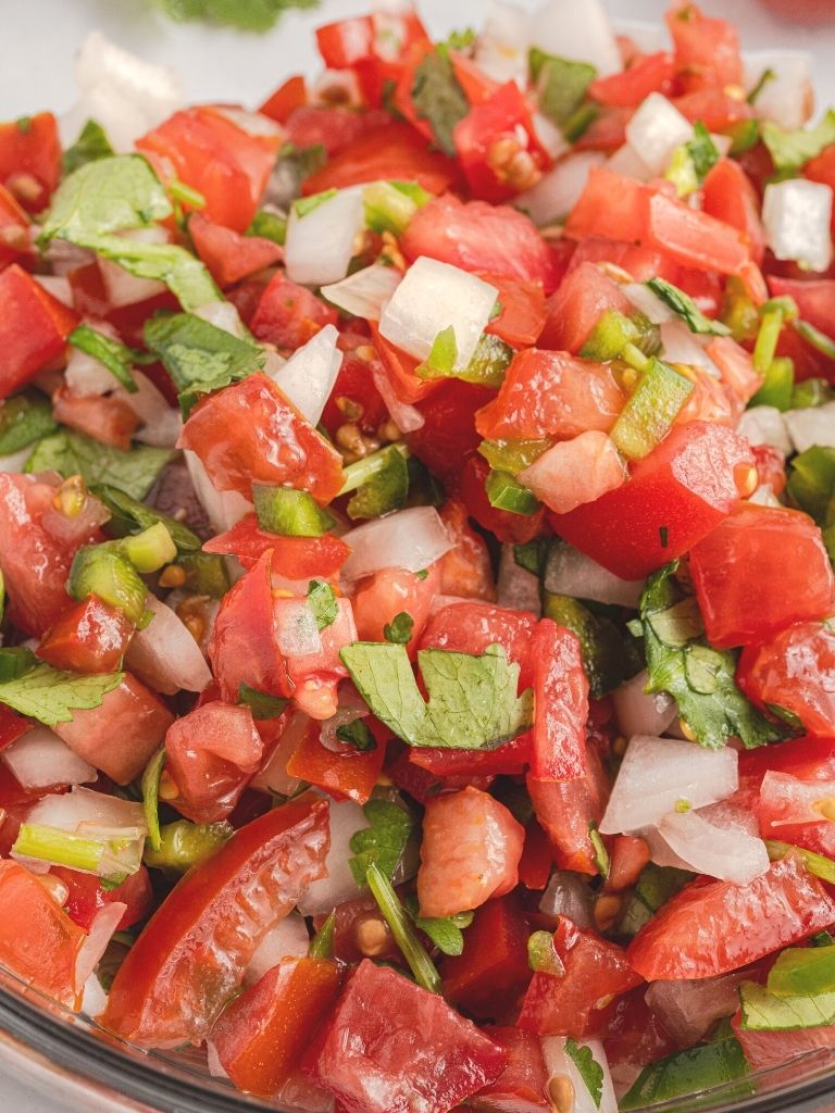 Close up picture of chopped tomato salsa. 