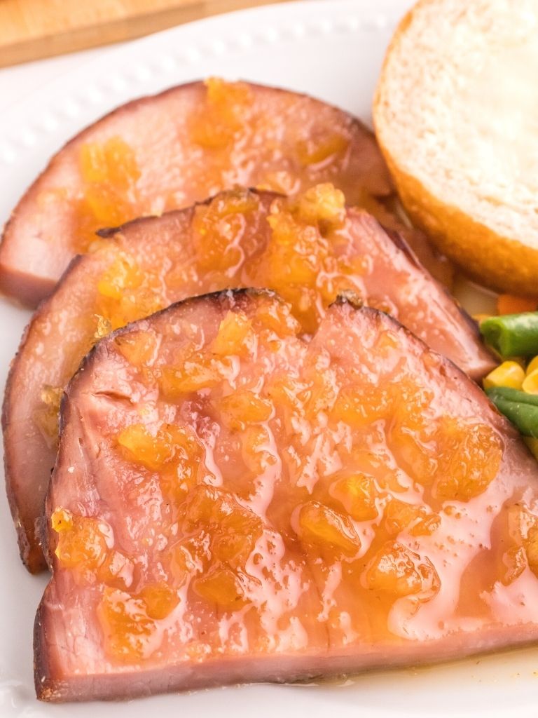 Slices of ham with a pineapple glaze over top. 