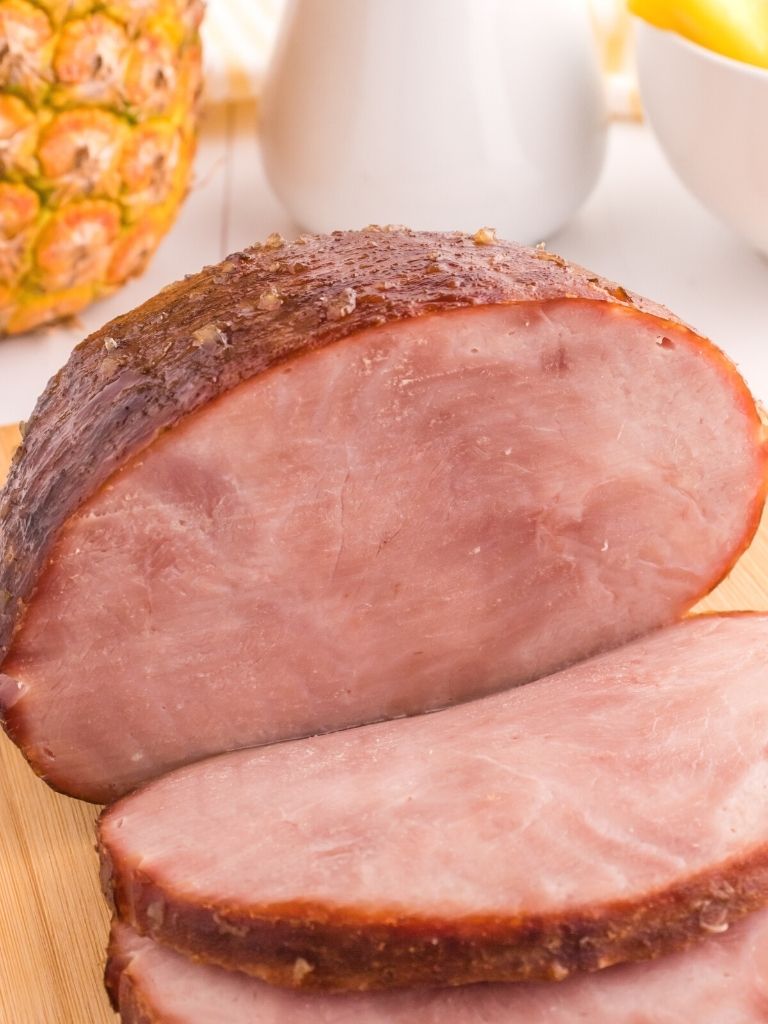 Cooked ham on a cutting board