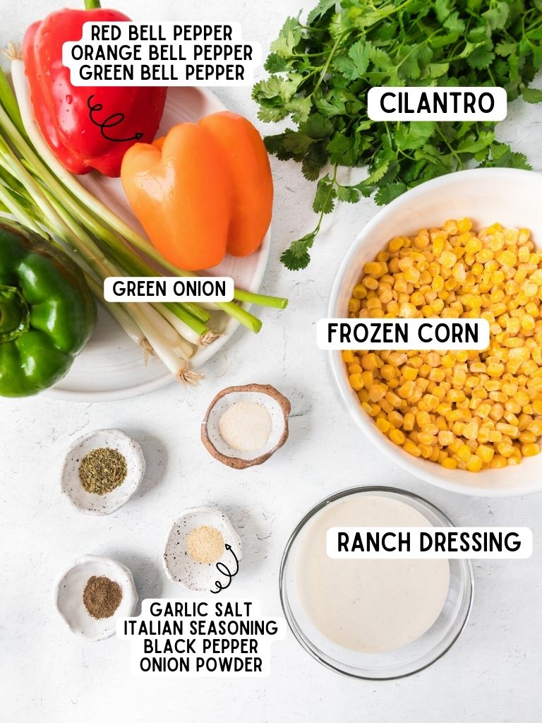 Ingredients for this ranch corn salad recipe on a white background with each one labeled in black text.