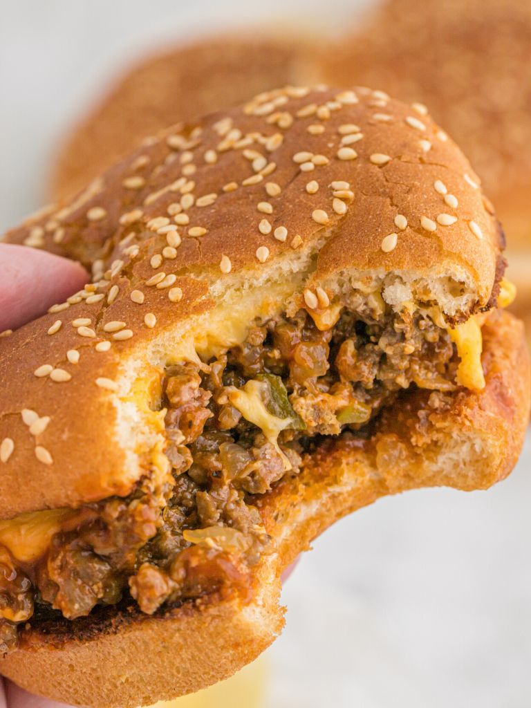 A sloppy Joe with a bite taken out of it to show the middle. 