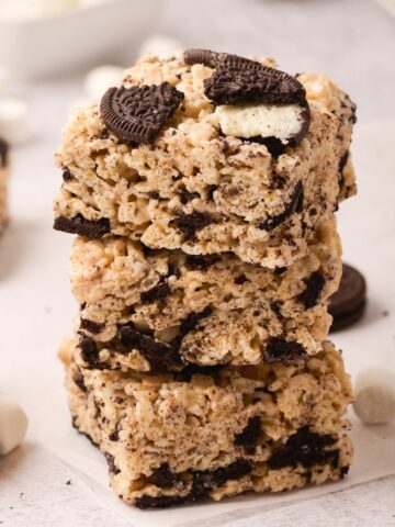 A stack of Krispie treats with Oreo cookies and mini marshmallows.
