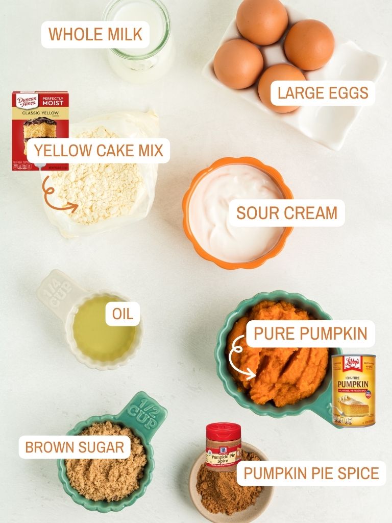 Ingredients for a pumpkin bundt cake with each one labeled in text with what it is. 