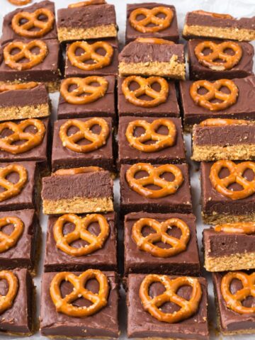 Lines of pretzel bars with some turned sideways to see the bottom layer.