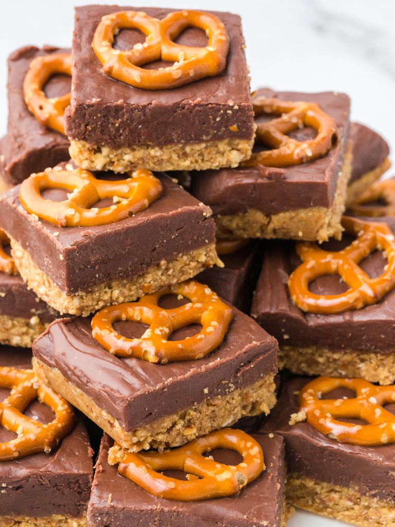A stack of pretzel bars on a white plate