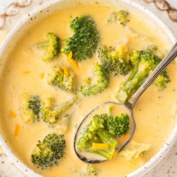 Overhead shot of broccoli soup with a spoon in the bowl.