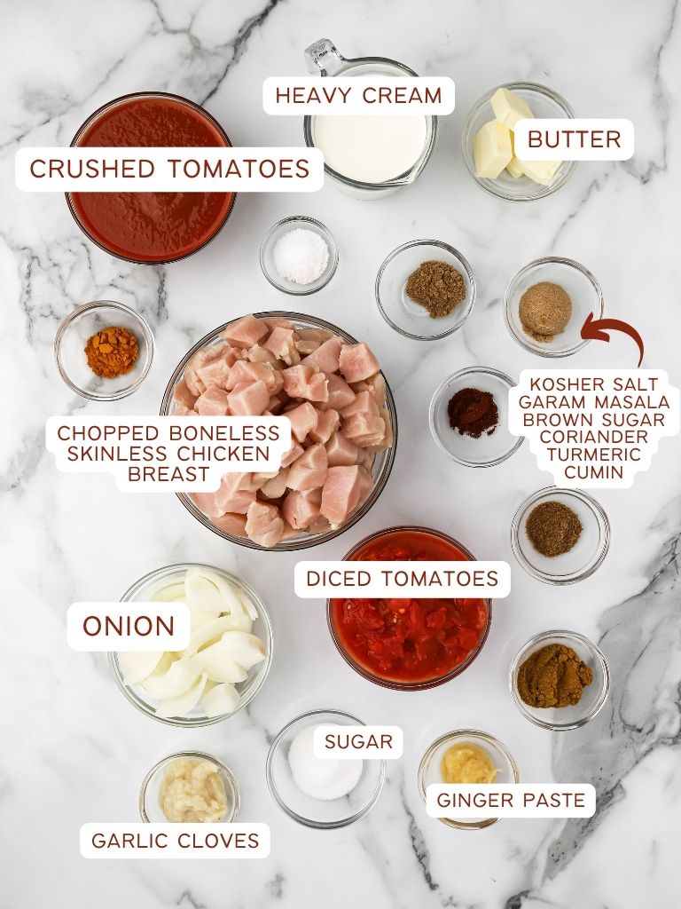 Ingredients for this Indian butter chicken recipe with each one labeled with what it is. 
