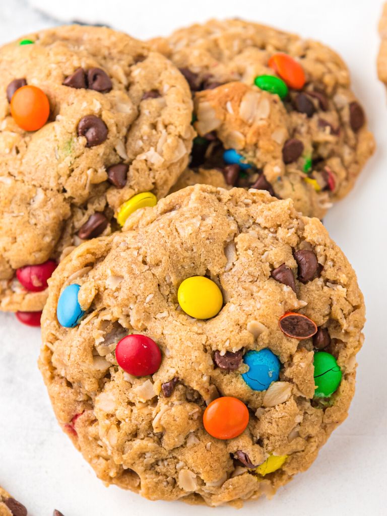 A cookie with m&m's on it and a close up shot to show the texture.