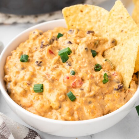 How to make this cheesy nacho dip recipe with step by step process photos.