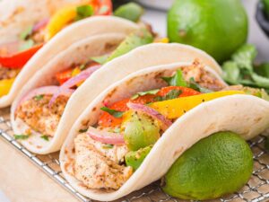 How to make this easy dinner recipe with step by step photos showing the process to make oven baked fajitas with chicken.