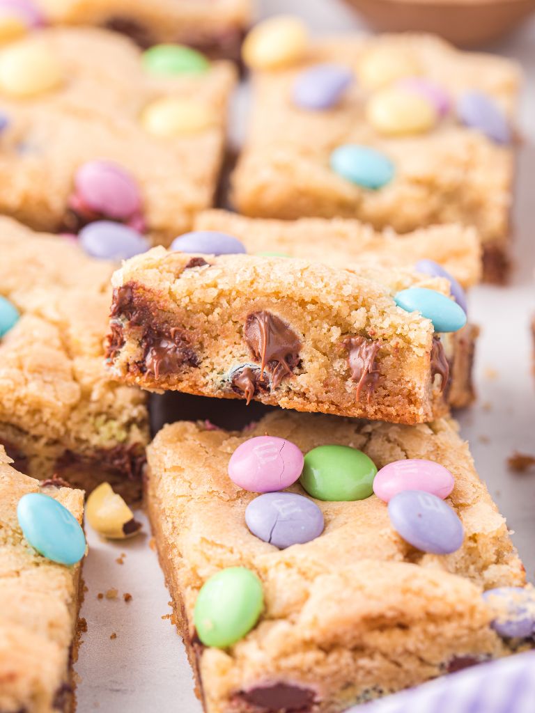 A layer of easter bars with one leaning on the other to show the inside. 