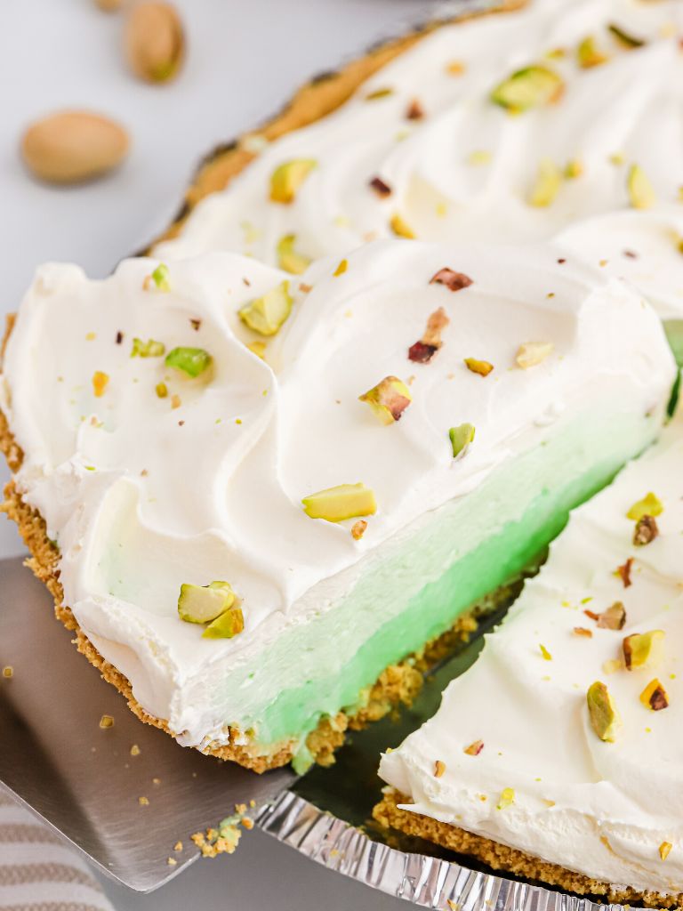 A pie tin with this no bake pistachio pie inside of it. 