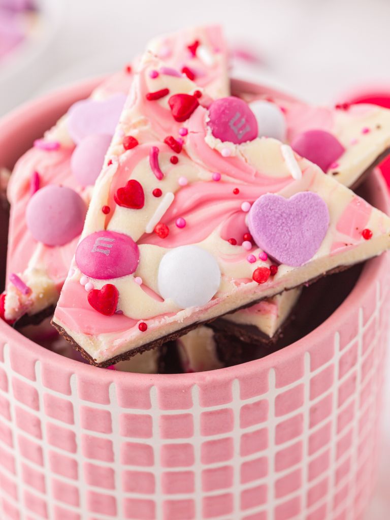 Chocolate bark inside a pink container.