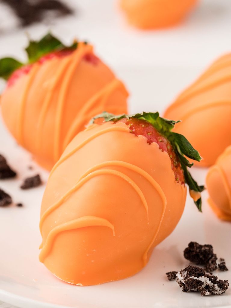 Carrot dipped strawberries that look like carrots. 