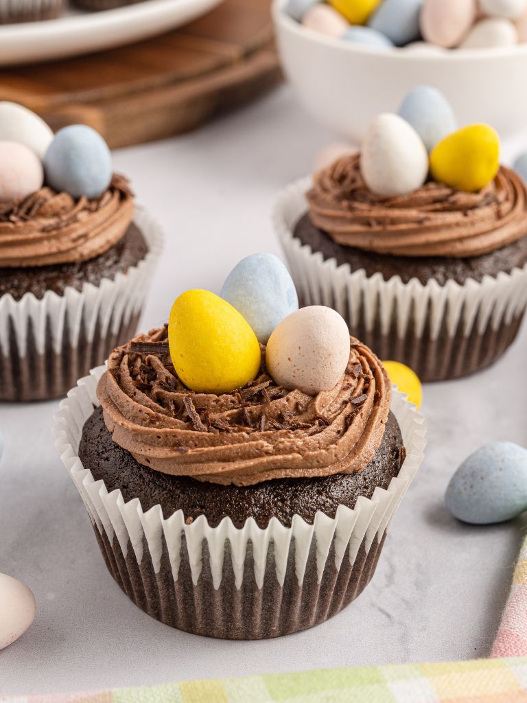 Cupcakes decorated with mini eggs.