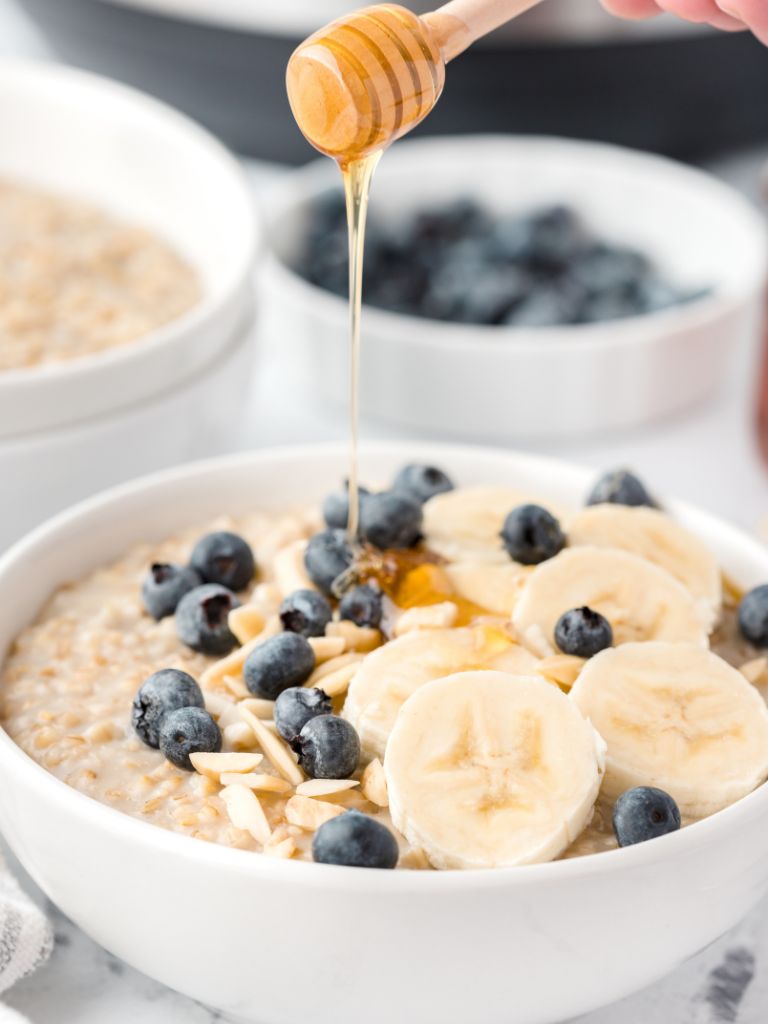 A drizzle of honey this bowl of cooked steel cut oatmeal. 