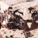 Close up of this brownie recipe with a bite taken out of the front one.