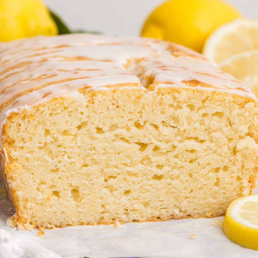A lemon loaf cut in half to show the center. 