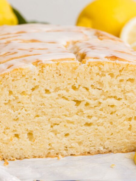 A lemon loaf cut in half to show the center.