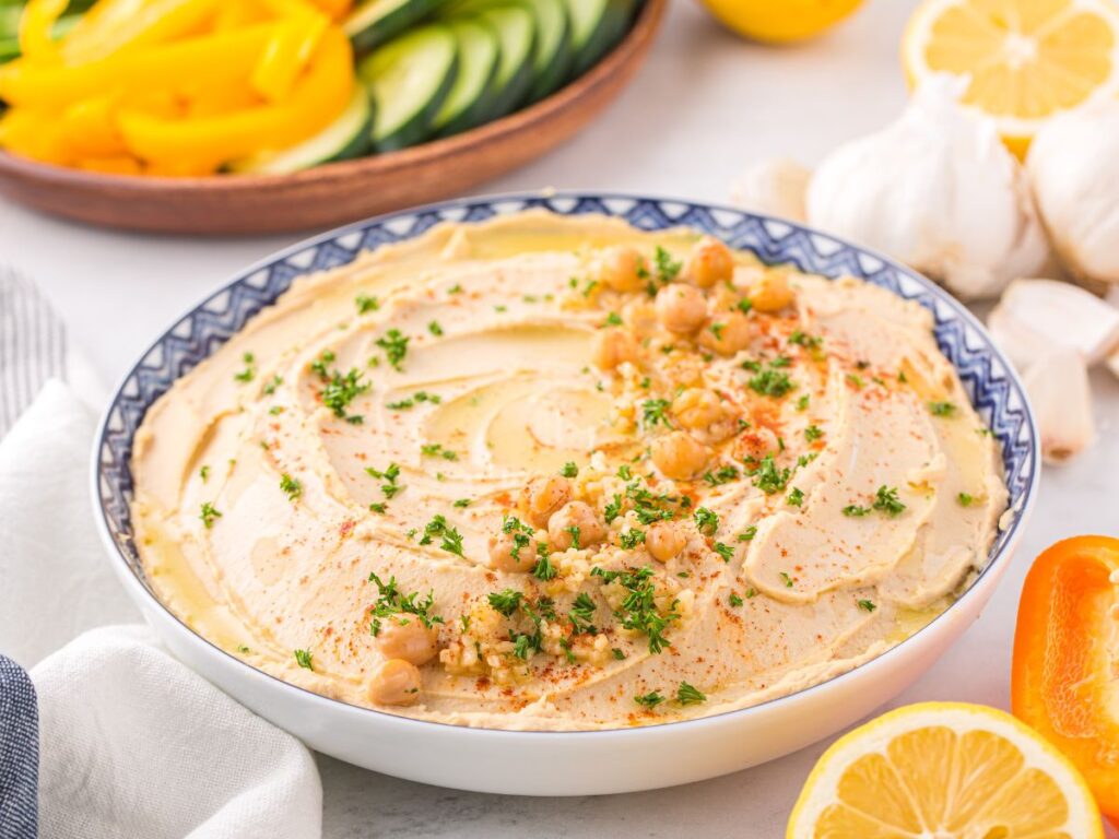 Step by step photos showing how to make this dip recipe with roasted garlic and tahini.