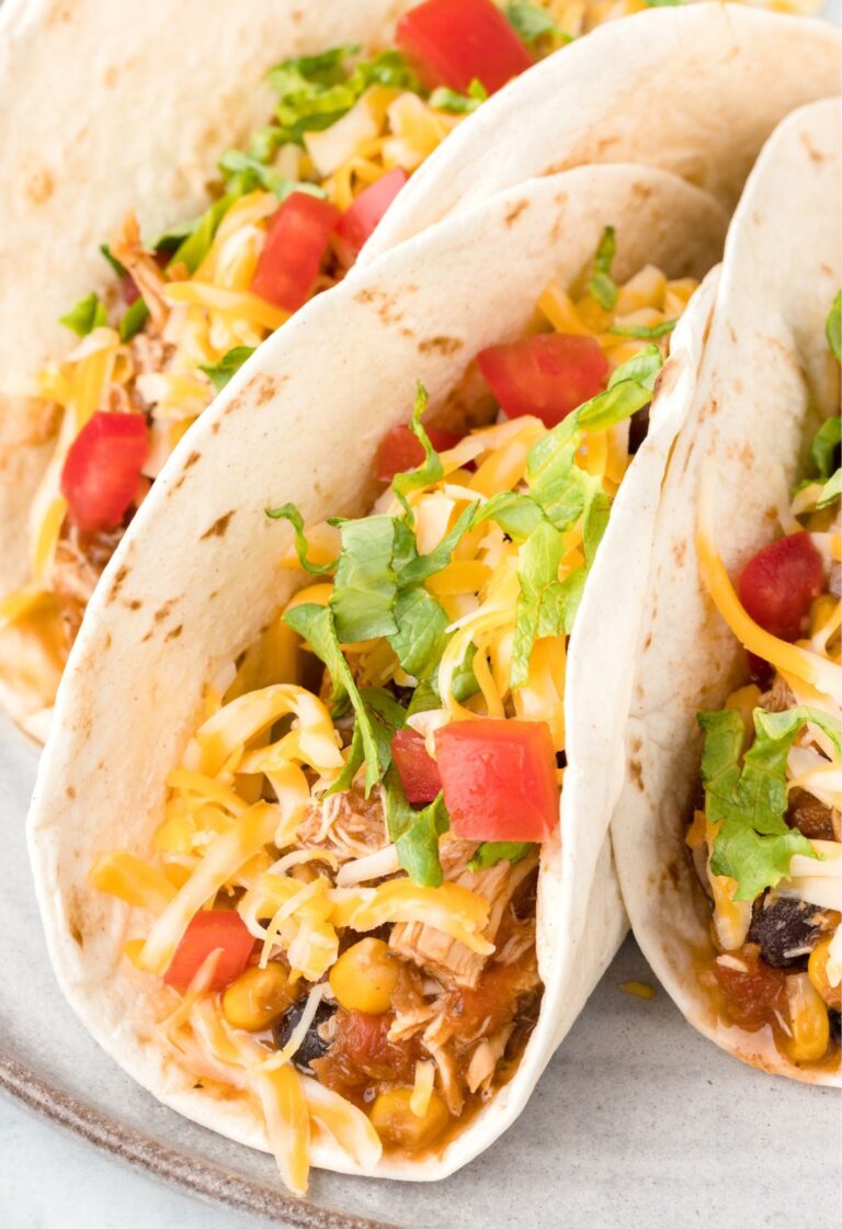 A soft taco filled with this chicken taco meat and toppings.