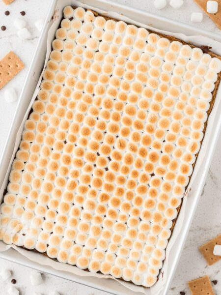 Overhead shot of the pan of toasted marshmallows on top of the bars.