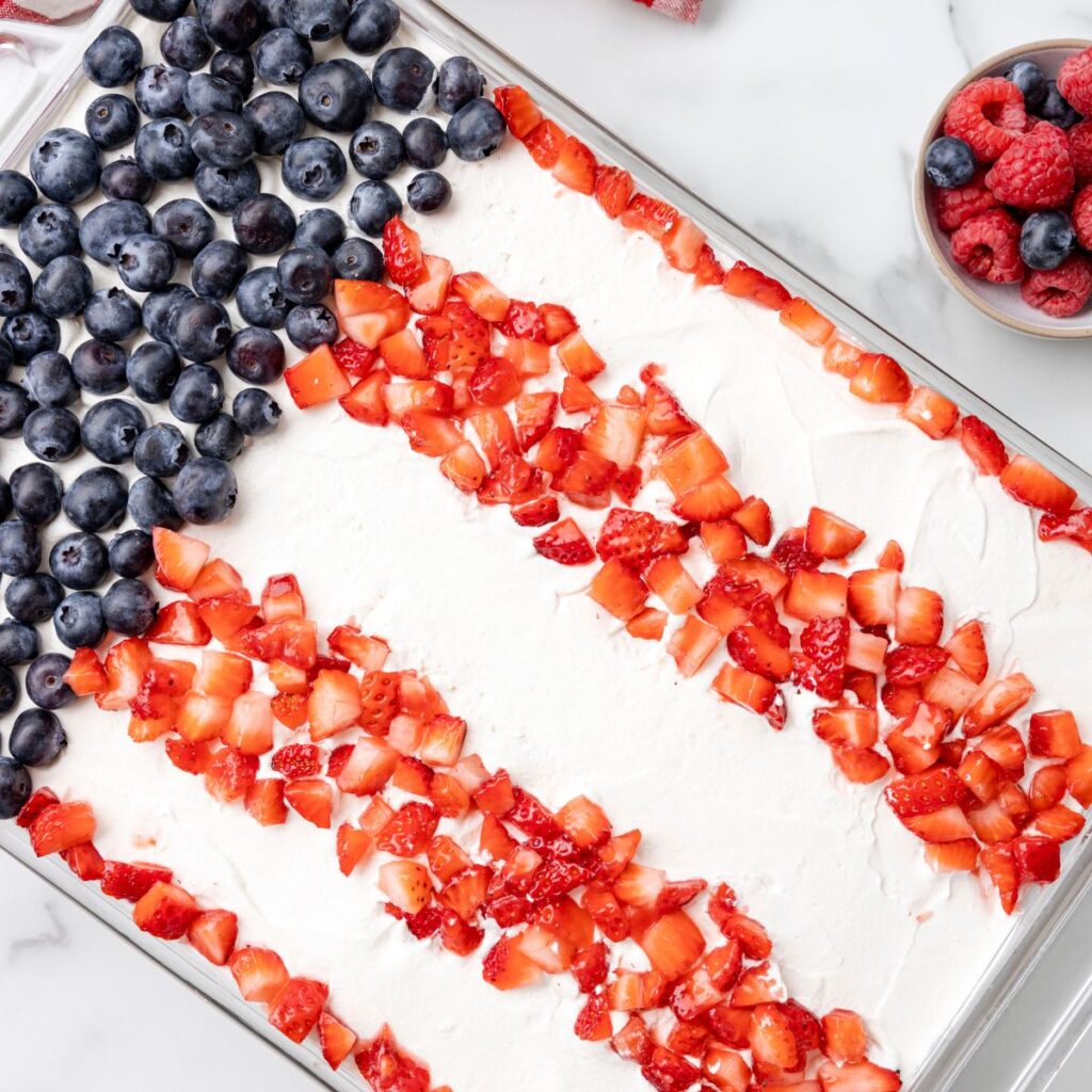 A icebox cake that is decorated like the flag on top. 