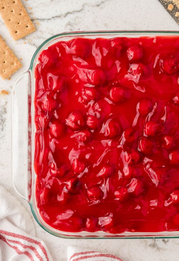 Overhead of the dessert pan with cherries on top. 