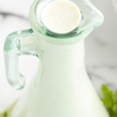 A glass container of ranch dressing