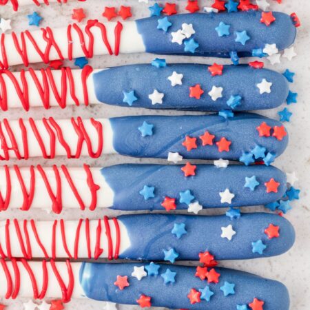 Line of american flag decorated pretzel rods.