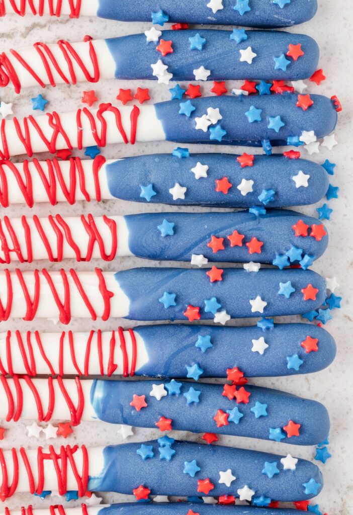 Line of american flag decorated pretzel rods. 