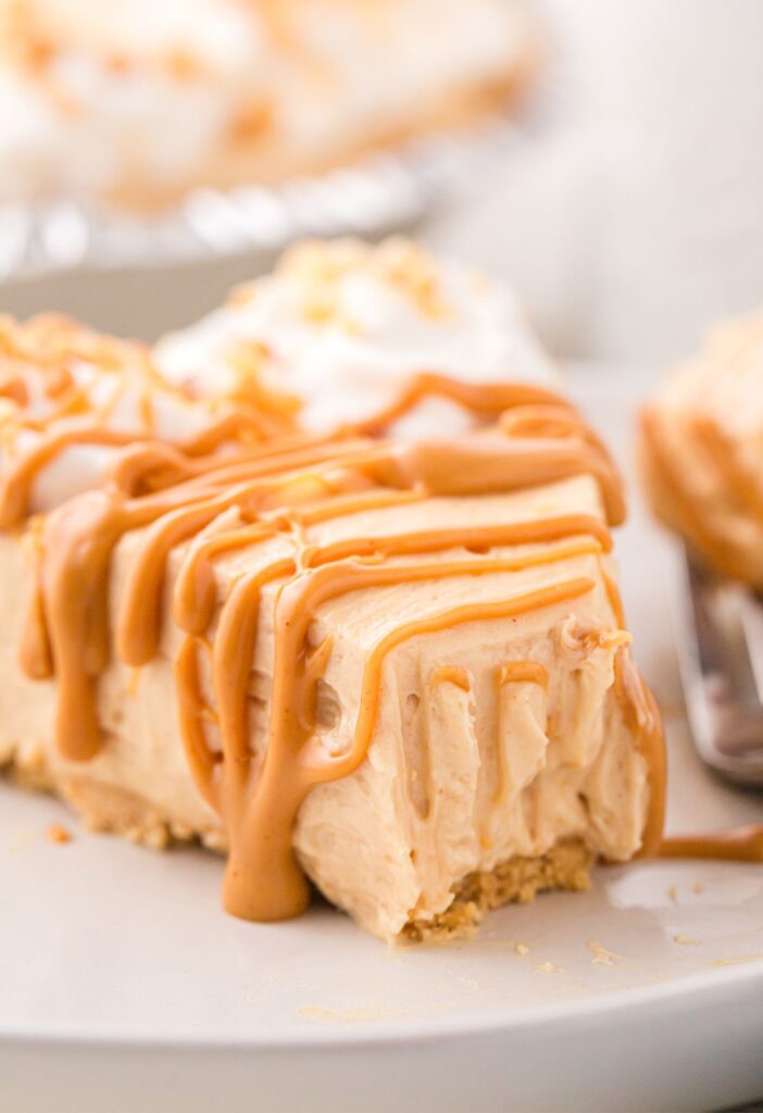 A slice of this pie with a peanut butter drizzle over top. 