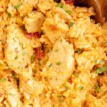 Close up of the pot of chicken and rice with queso sauce.