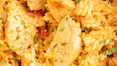 Close up of the pot of chicken and rice with queso sauce.