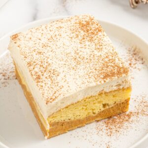 A square photo of the layered magic cake with pumpkin.