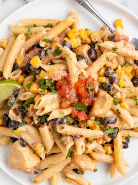A serving of this penne pasta recipe on a white plate.