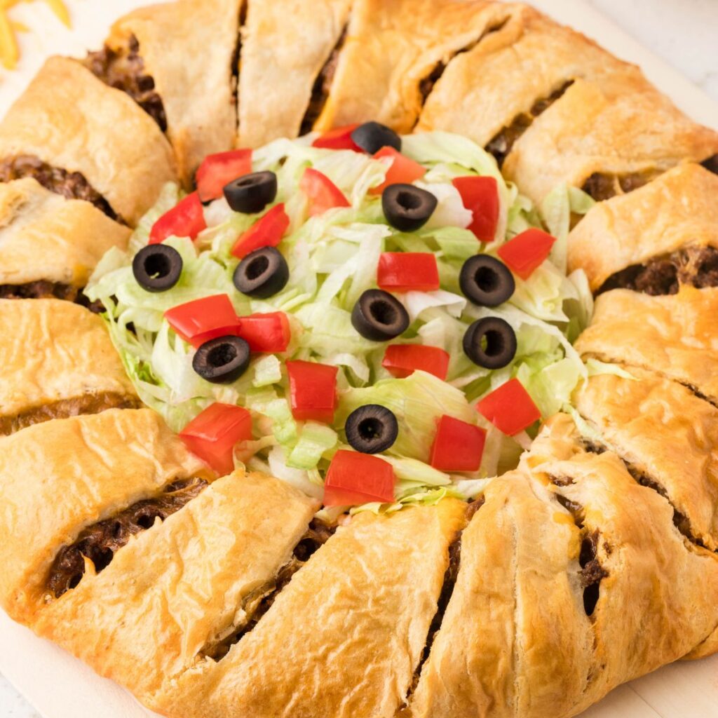 A ring made of crescent dough with toppings in the center. 