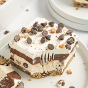 Process photos for this layered lush dessert recipe, also called cookie dough delight.