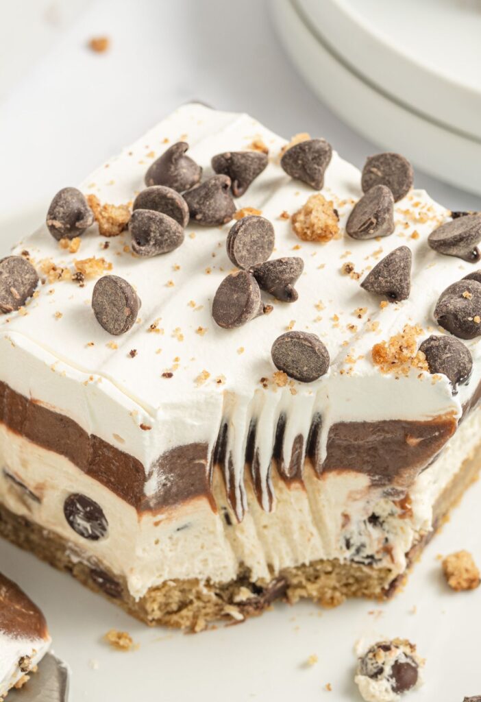 A slice of this layered lush dessert topped with mini chocolate chips. 