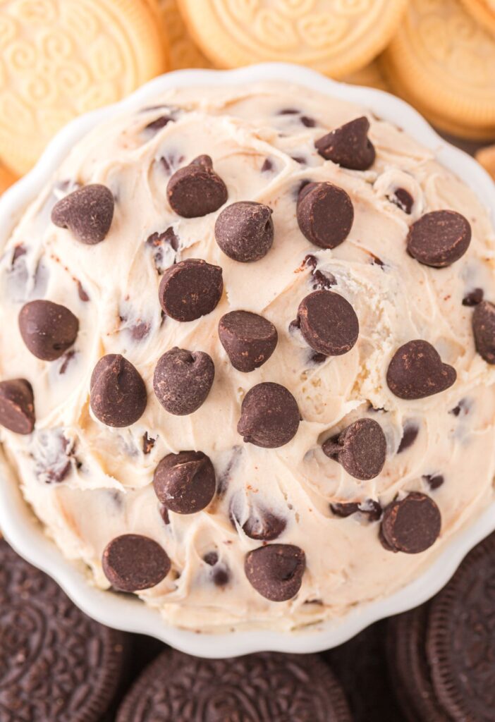 Bowl of dip with chocolate chips on top. 