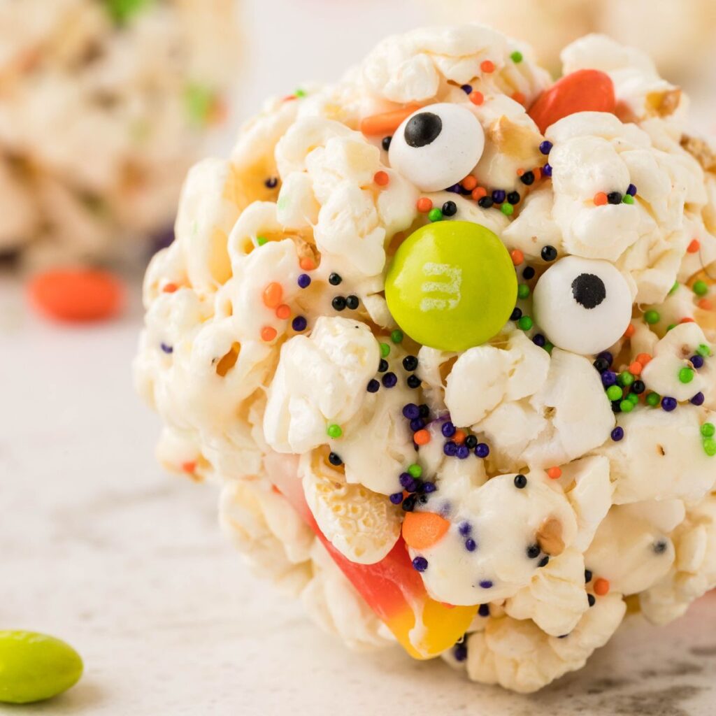 Square photo of the side shot of the marshmallow popcorn ball. 