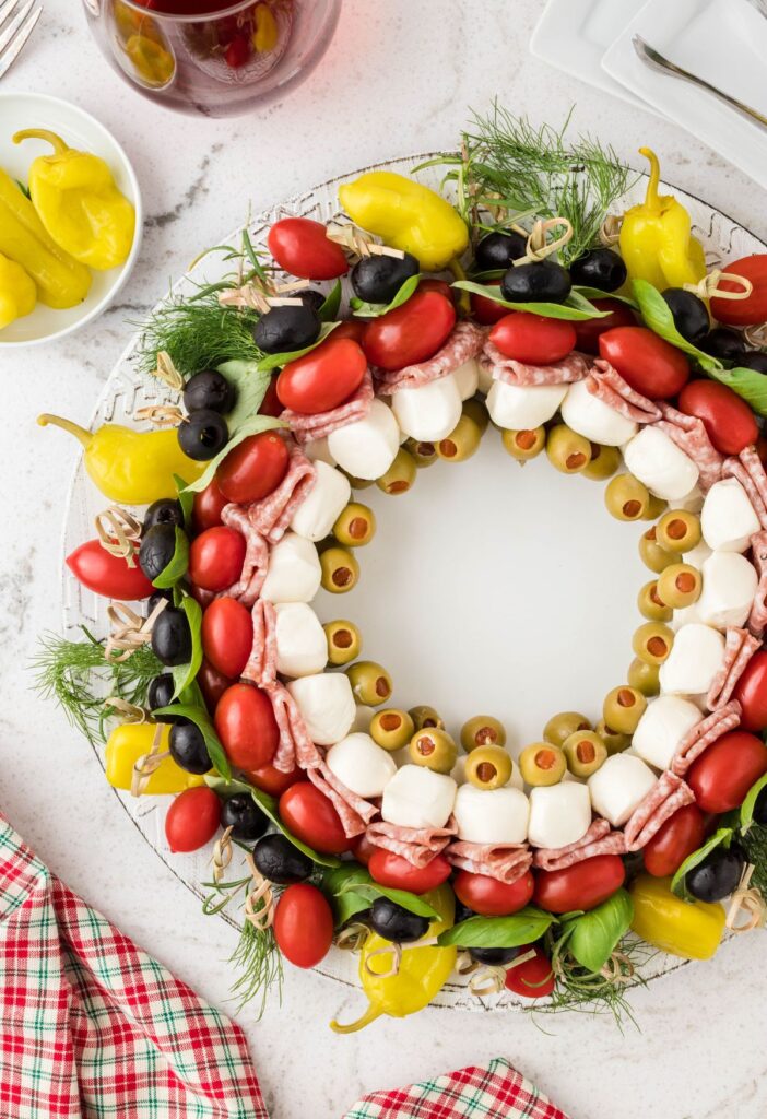 Appetizer skewers arranged in a circular pattern for a wreath. 