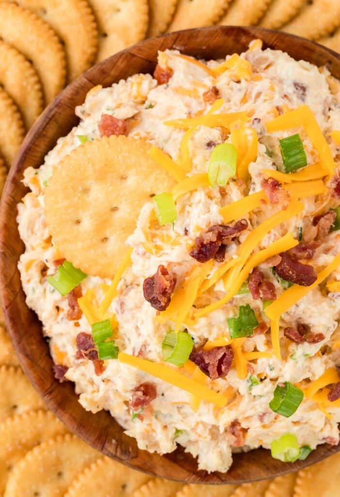 Dip inside a bowl with a cracker in it. 