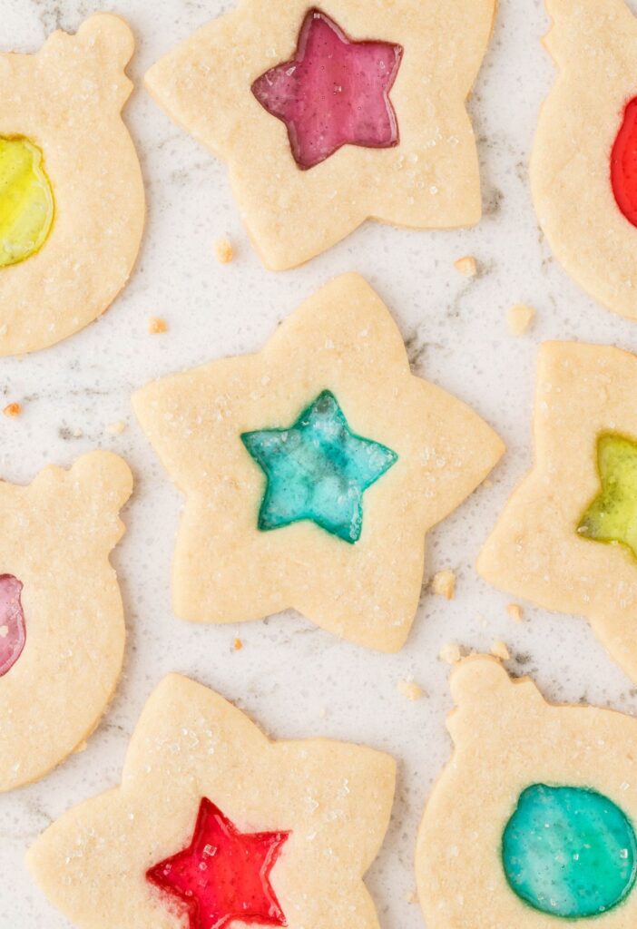 Baked cookies with a stained window in the center made of candy. 