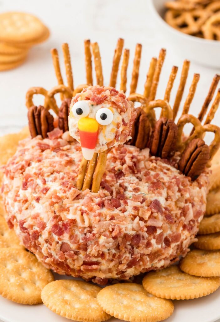 A cheeseball with pretzels in it and a head to make it look like a turkey. 