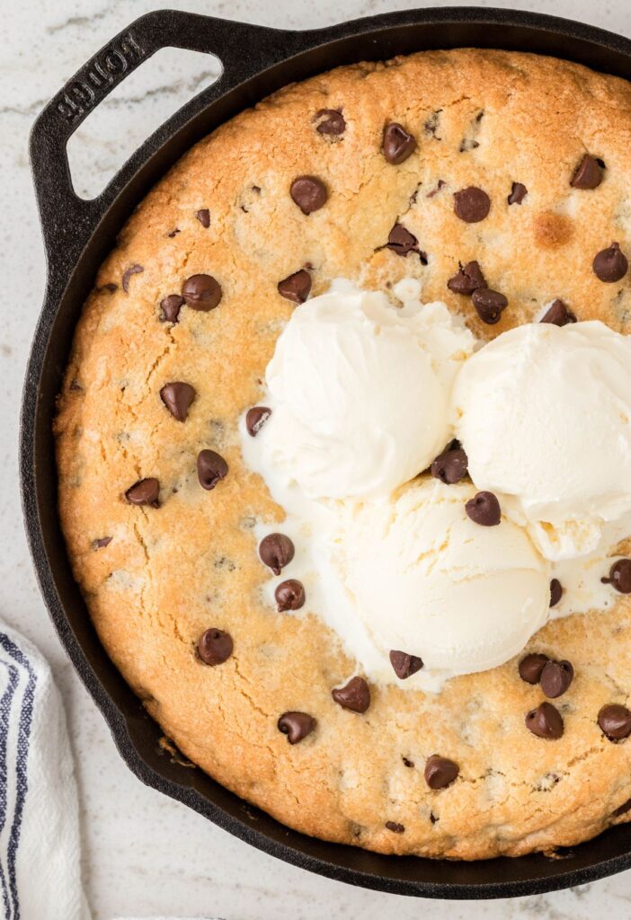 A skillet cookie topped with ice cream. 
