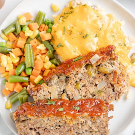 Serving plate with sides and meatloaf.